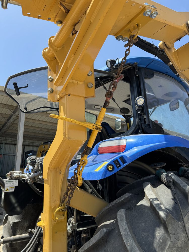Farm equipment repair on tractor loader